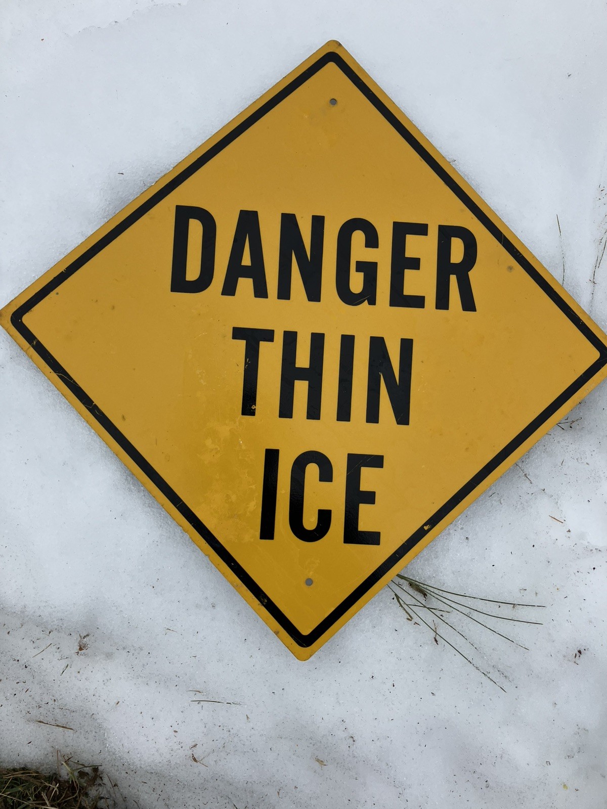 Vintage snowmobile sign trail ‘Danger thin ice’, decommissioned.